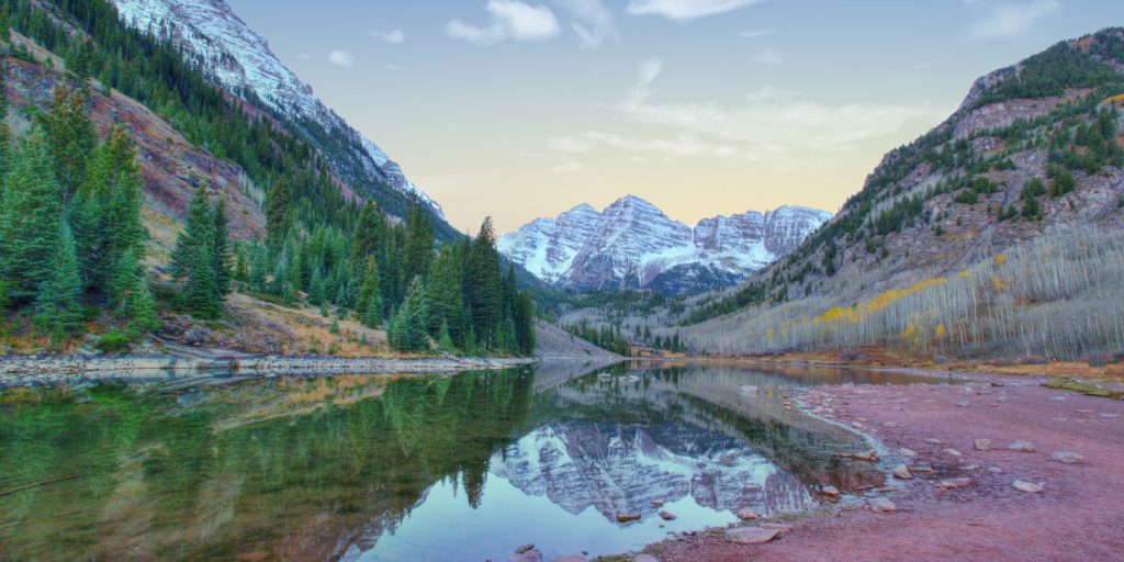 The Maroon Bells twin peaks reflected in Maroon Lake near Aspen, Colorado